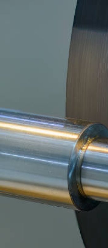 Close up scene the cylindrical grinding machine operation. The metal working process by grinding machine.